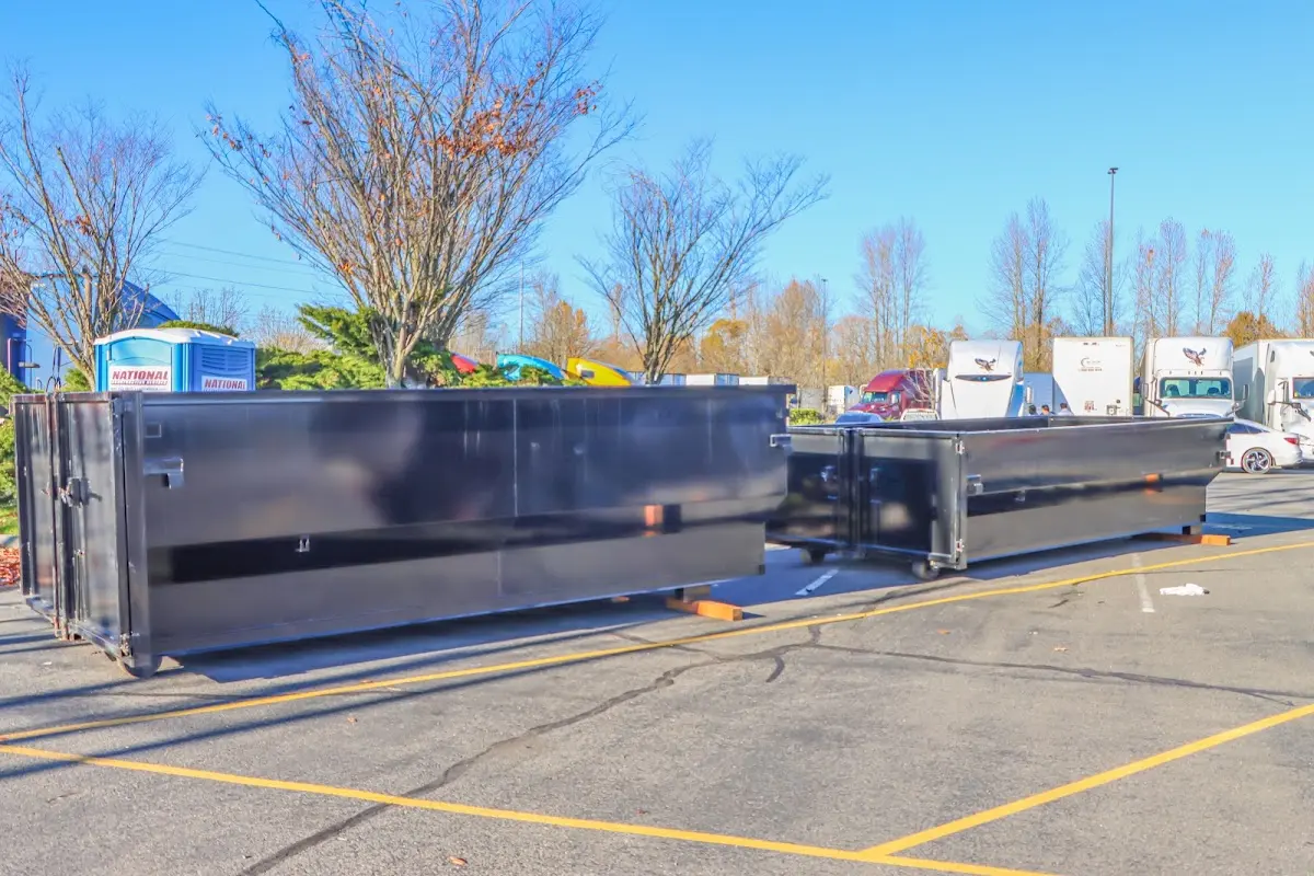Professional dumpster rental service with roll-off container on residential driveway in Hoffman Estates